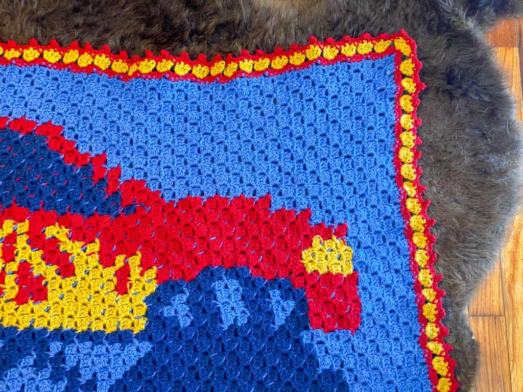 You can make this easy C2C crochet Monster Truck Blanket! Free pattern for any eager beginner. Perfect size for a crib, toddler or twin sized bed. Using Lion Brand Pound of Love yarn. 