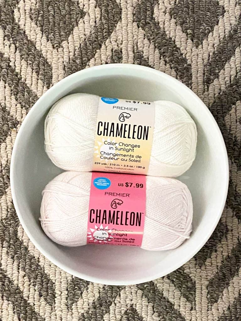 If you've been into Michaels lately you've probably seen this summer's hottest new yarn product... Premier Yarns Chameleon. This yarn is 100% cotton and changes from white to a variety of different colors in the sunlight. But at $7.99 for only 3.5 oz you have to wonder is it really worth it... I recently bought three skeins and put it to the test and wanted to share my opinion with all you fellow yarn lovers. 